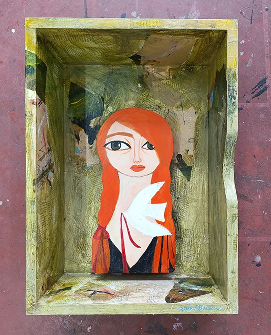 Redhead girl with white bird
